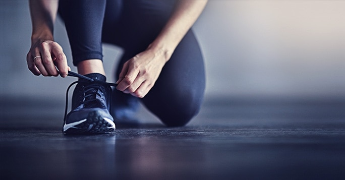 woman tying her laces