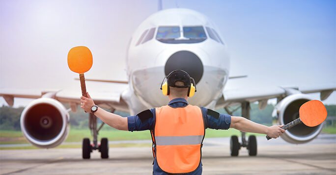 Airport officials are signaling the landing of the aircraft