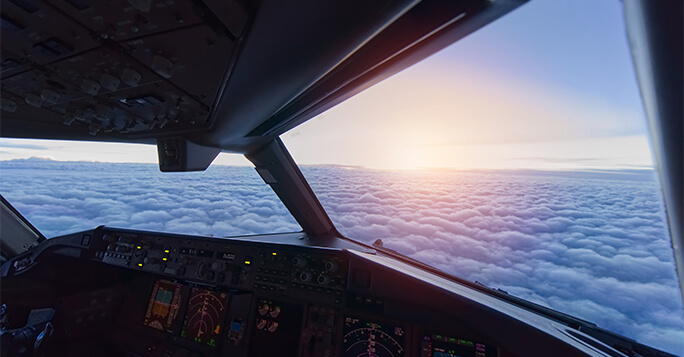 Sky view from airplane inside cockpit