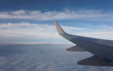 Avoid cloud turbulence with a well-architected framework. View from plane wing.